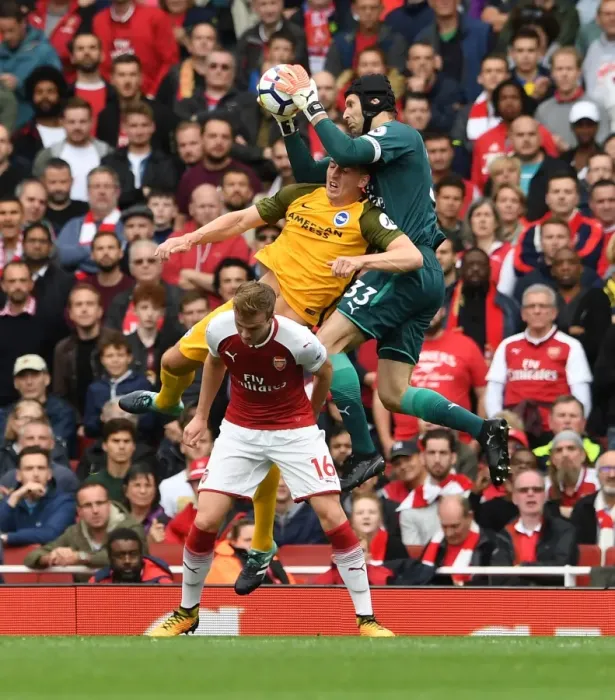 Framed Print : Arsenal's Petr Cech Clashes with Brighton's Shane Duffy in Premier League Showdown