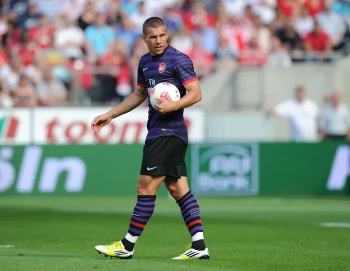 Framed Print : Arsenal's Podolski in Action: Cologne Pre-Season Clash, 2012