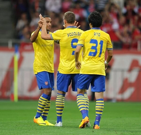 Arsenal's Podolski, Walcott, and Miyaichi Celebrate Goal against Urawa Red Diamonds (2013)