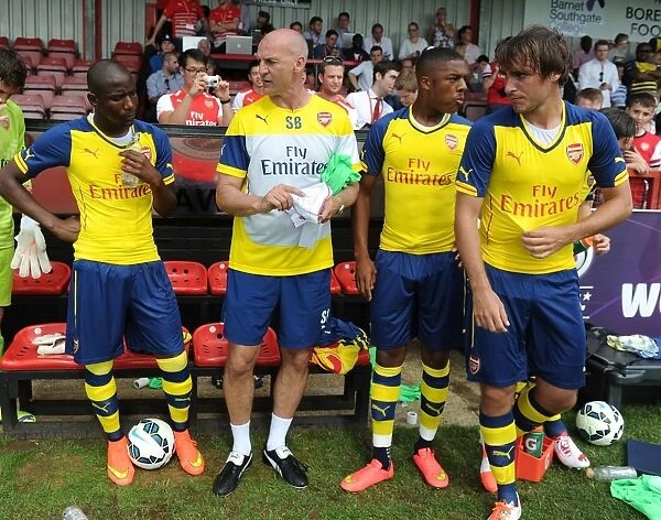 Arsenal's Pre-Season Training: Bould Guides Akpom, Afobe, and Miquel at Borehamwood