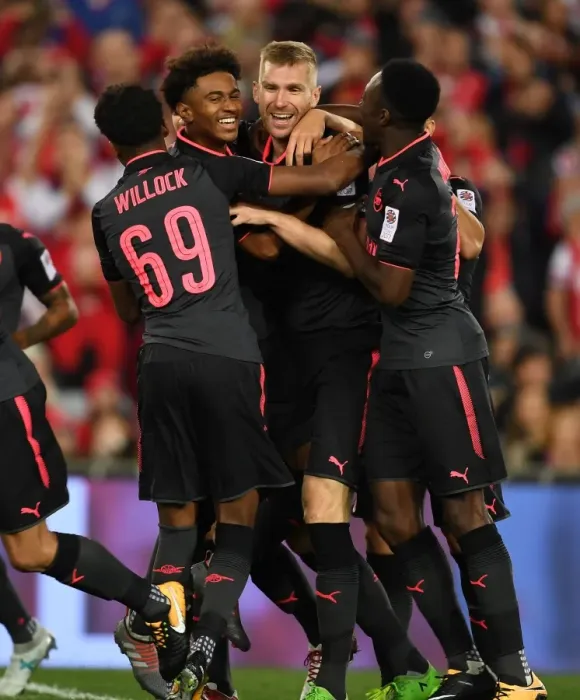 Framed Print : Arsenal's Pre-Season Victory: Mertesacker, Nelson, Willock, and Welbeck Score in Sydney FC Clash (2017-18)