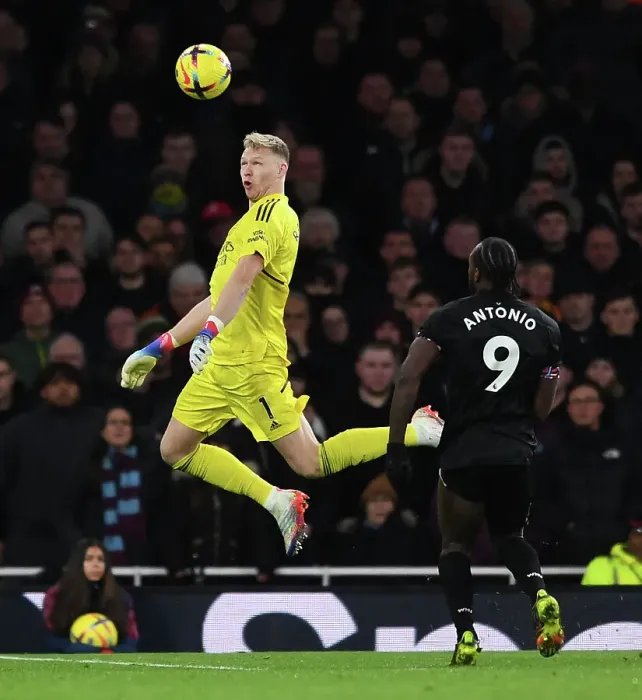 Framed Print : Arsenal's Ramsdale Fends Off West Ham's Antonio: A Headed Battle in the Premier League