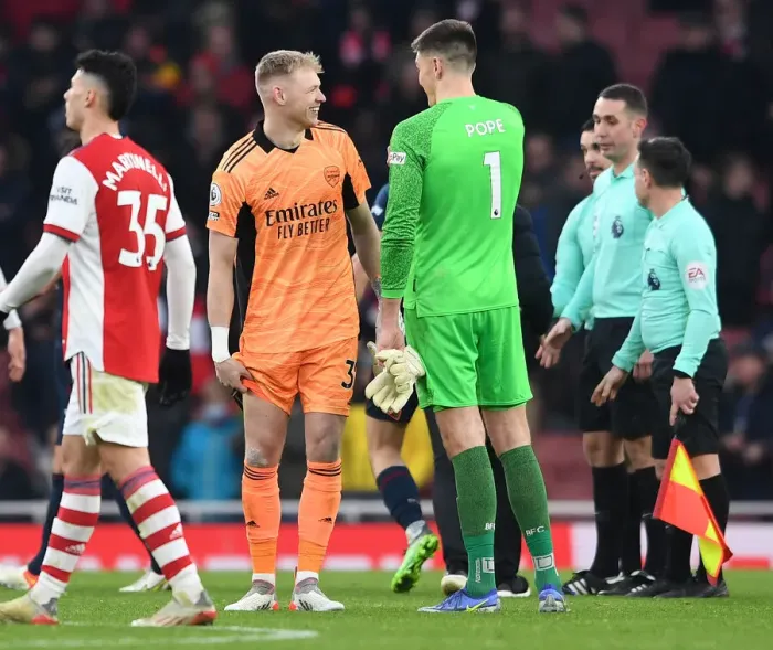 Framed Print : Arsenal's Ramsdale and Pope Share a Moment After Arsenal v Burnley Match