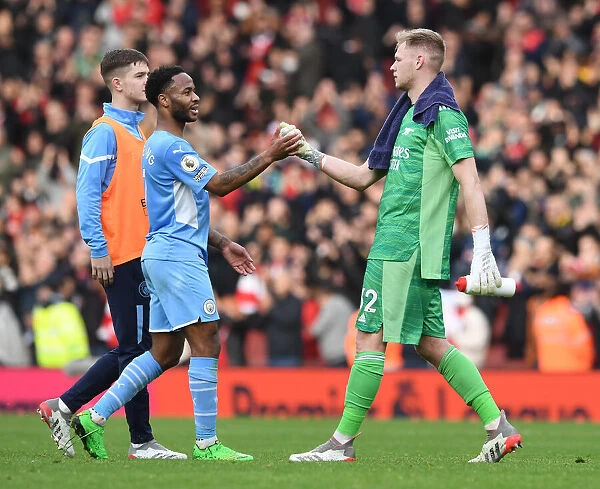 Arsenal's Ramsdale and Sterling Share a Moment After Intense Arsenal v Manchester City Clash (2021-22)