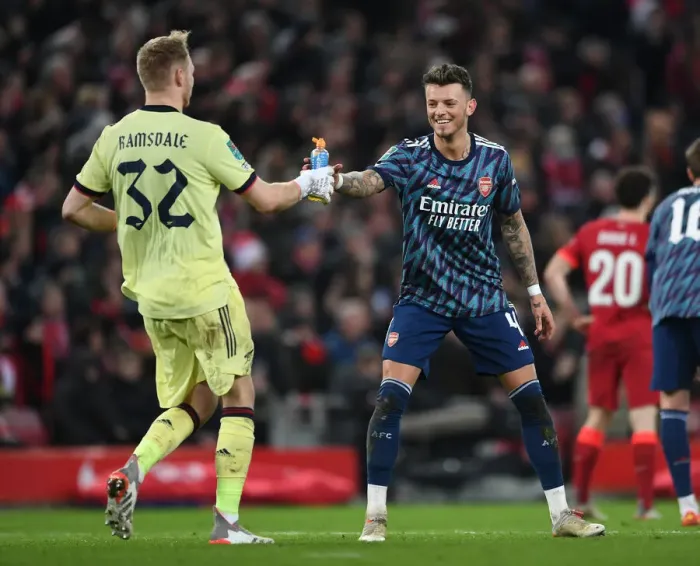 Framed Print : Arsenal's Ramsdale and White Lock Horns in Intense Carabao Cup Semi-Final Showdown Against Liverpool