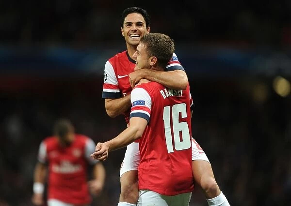 Arsenal's Ramsey and Arteta Celebrate Goal Against Olympiacos in 2012-13 Champions League