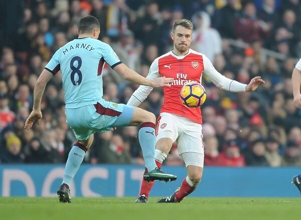 Arsenal's Ramsey Battles Marney in Intense Arsenal v Burnley Clash, Premier League 2016-17
