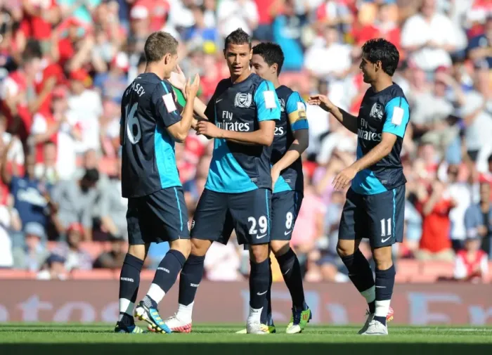 Framed Print : Arsenal's Ramsey, Chamakh, Nasri, and Vela Celebrate Goals Against Boca Juniors at Emirates Cup, 2011