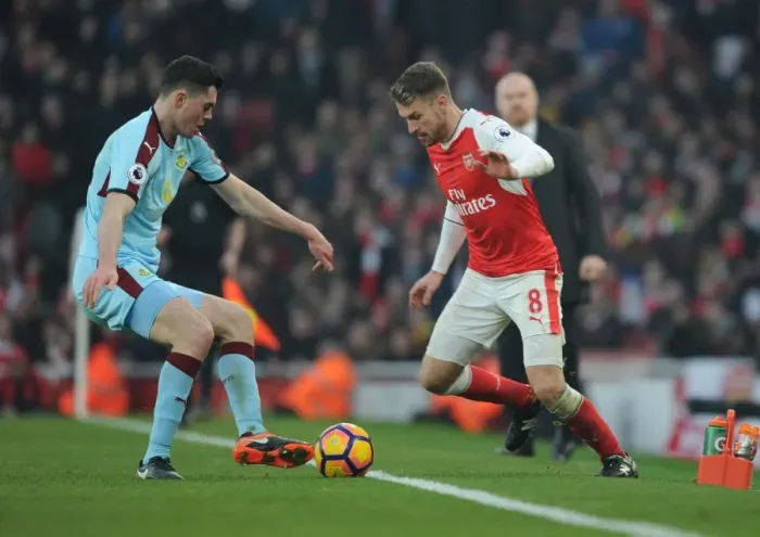 Framed Print : Arsenal's Ramsey Clashes with Burnley's Keane in Premier League Showdown Framed Print : Arsenal's Ramsey Clashes with Burnley's Keane in Premier League Showdown