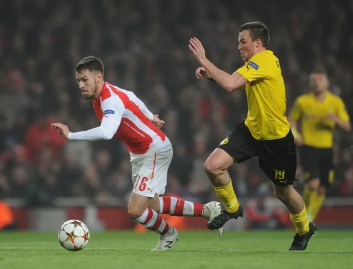 Framed Print : Arsenal's Ramsey Clashes with Dortmund's Grosskreutz in Champions League Showdown Framed Print : Arsenal's Ramsey Clashes with Dortmund's Grosskreutz in Champions League Showdown