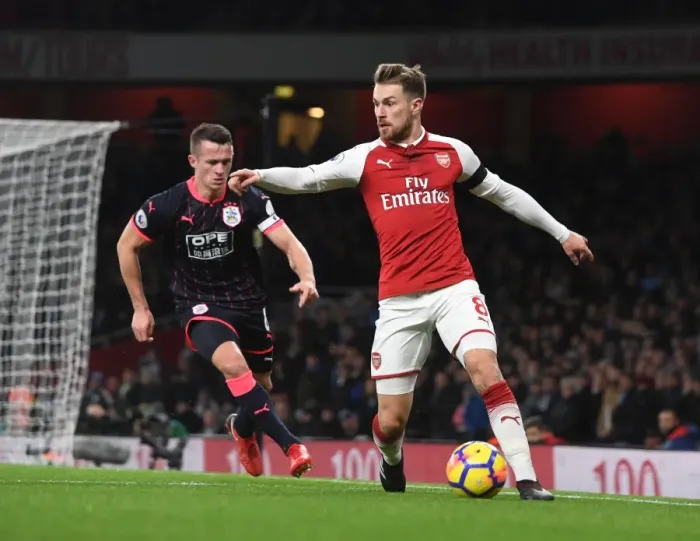 Framed Print : Arsenal's Ramsey Clashes with Huddersfield's Hogg in Premier League Showdown Framed Print : Arsenal's Ramsey Clashes with Huddersfield's Hogg in Premier League Showdown