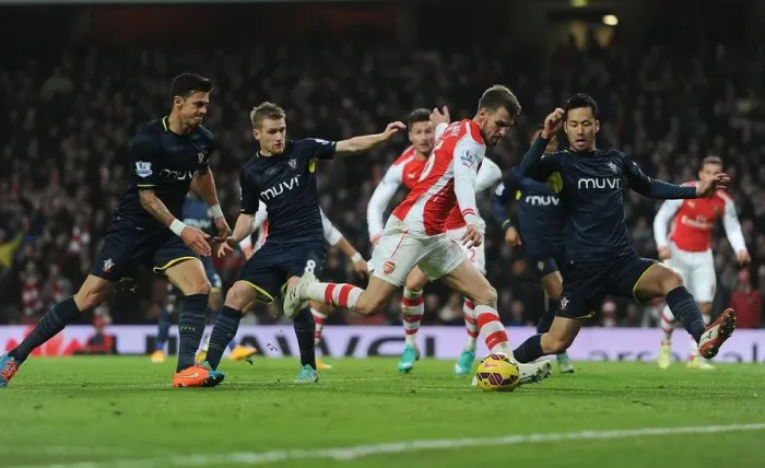 Framed Print : Arsenal's Ramsey Clashes with Southampton's Yoshida and Davis during Premier League Match Framed Print : Arsenal's Ramsey Clashes with Southampton's Yoshida and Davis during Premier League Match