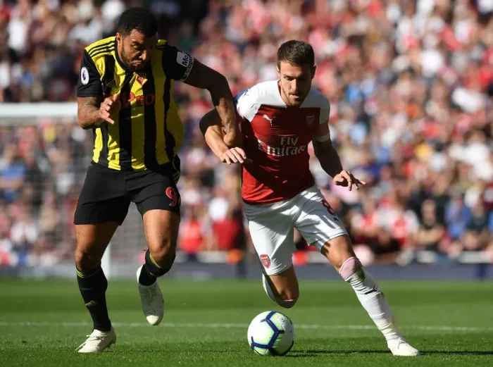 Framed Print : Arsenal's Ramsey Clashes with Watford's Deeney in Premier League Showdown