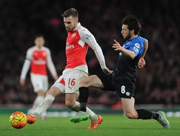 Arsenal's Ramsey Faces Intense Pressure from Bournemouth's Arter in Premier League Showdown