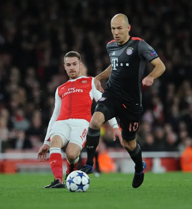 Framed Print : Arsenal's Ramsey Faces Off Against Robben in Champions League Showdown