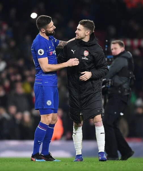 Arsenal's Ramsey and Giroud Embrace After Intense Arsenal v Chelsea Clash