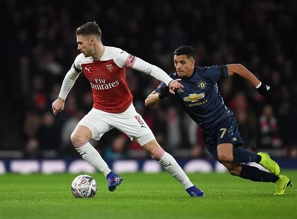 Arsenal's Ramsey Outmaneuvers Manchester United's Sanchez in FA Cup Clash