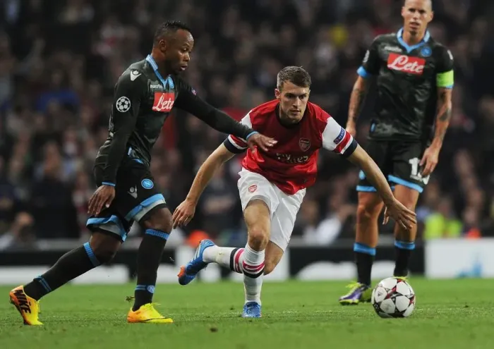 Framed Print : Arsenal's Ramsey Outmaneuvers Napoli's Zuniga in 2013-14 Champions League Clash Framed Print : Arsenal's Ramsey Outmaneuvers Napoli's Zuniga in 2013-14 Champions League Clash