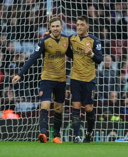 Arsenal's Ramsey and Ozil: Celebrating a Goal-Scoring Duo in Aston Villa vs Arsenal (2015-16)