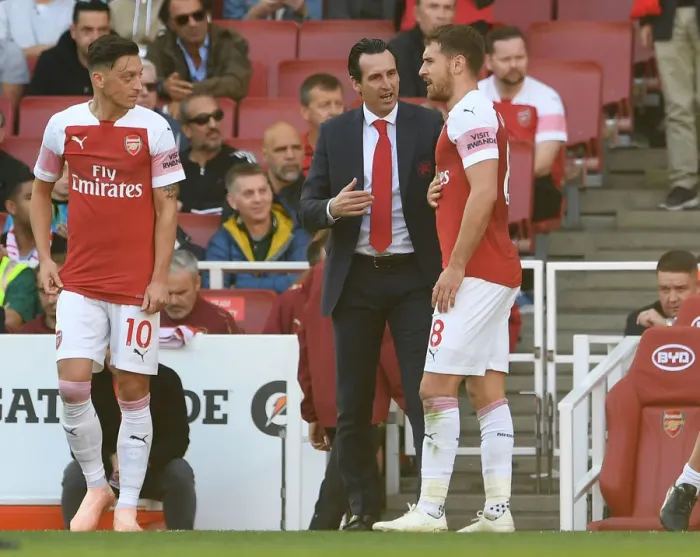 Framed Print : Arsenal's Ramsey Receives Strategic Guidance from Coach Emery during a Premier League Match Framed Print : Arsenal's Ramsey Receives Strategic Guidance from Coach Emery during a Premier League Match