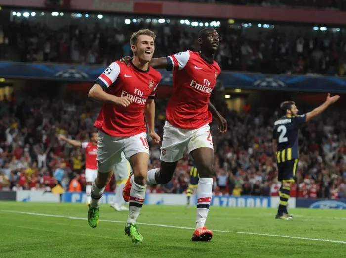 Framed Print : Arsenal's Ramsey and Sanogo: United in Victory - Celebrating Goals in the 2013-14 UEFA Champions League Play-offs against Fenerbahce Framed Print : Arsenal's Ramsey and Sanogo: United in Victory - Celebrating Goals in the 2013-14 UEFA Champions League Play-offs against Fenerbahce