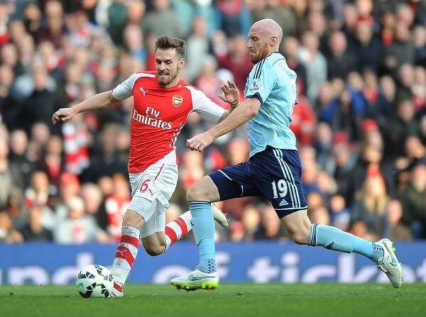 Arsenal's Ramsey Scores Past Collins in Arsenal v West Ham Premier League Clash