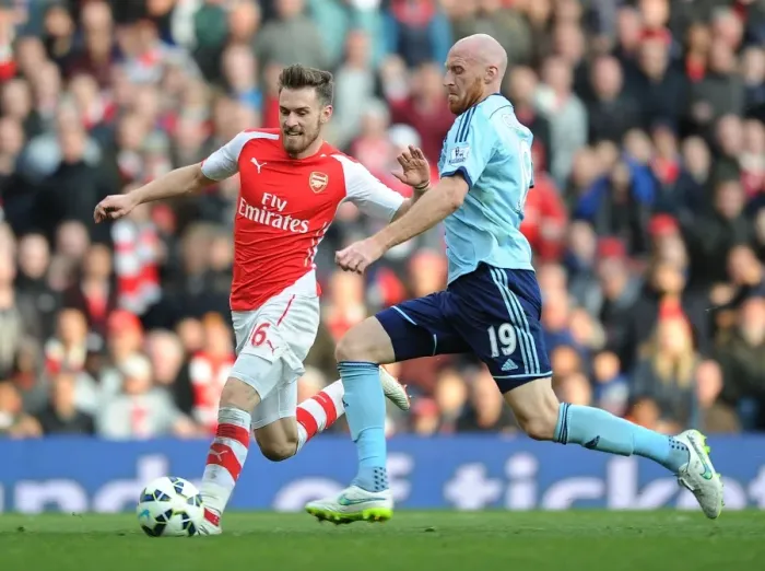 Framed Print : Arsenal's Ramsey Scores Past Collins in Arsenal v West Ham Premier League Clash Framed Print : Arsenal's Ramsey Scores Past Collins in Arsenal v West Ham Premier League Clash
