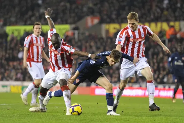 Framed Print : Arsenal's Ramsey Scores Twice as Gunners Overpower Shawcross and Faye's Stoke