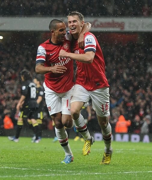 Arsenal's Ramsey and Walcott in Jubilant Moment after Scoring against Wigan Athletic (2012-13)