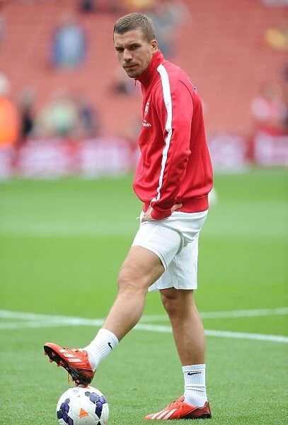 Arsenal's Ready-to-Go Striker: Lukas Podolski Gears Up Against Aston Villa (2013-14)