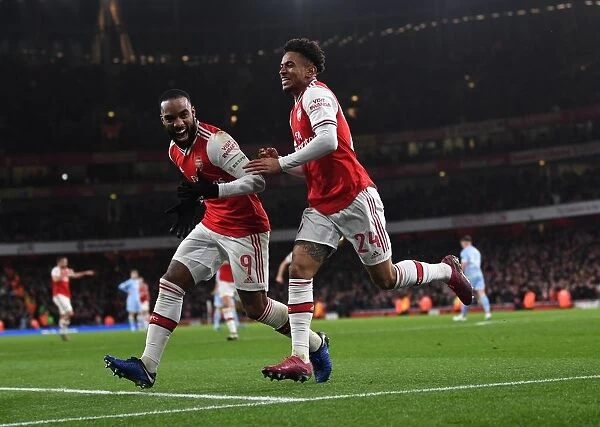 Arsenal's Reiss Nelson and Alexandre Lacazette Celebrate Goal Against Leeds United in FA Cup Third Round