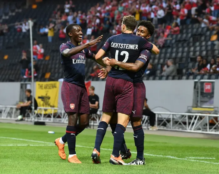 Framed Print : Arsenal's Reiss Nelson, Eddie Nketiah, and Stephan Lichtsteiner Celebrate Goal Against SS Lazio in 2018 Pre-Season Friendly Framed Print : Arsenal's Reiss Nelson, Eddie Nketiah, and Stephan Lichtsteiner Celebrate Goal Against SS Lazio in 2018 Pre-Season Friendly