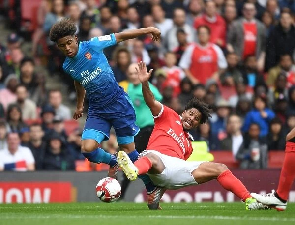 Arsenal's Reiss Nelson Fends Off Eliseu in Emirates Cup Clash