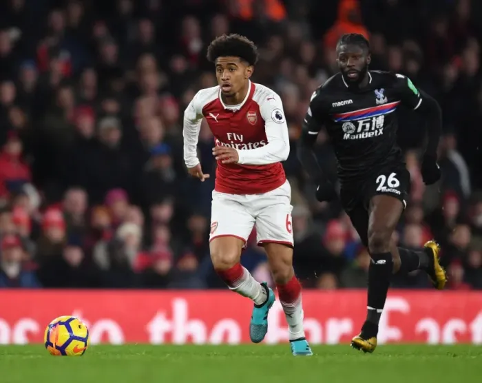 Framed Print : Arsenal's Reiss Nelson Outmaneuvers Crystal Palace's Bakary Sako