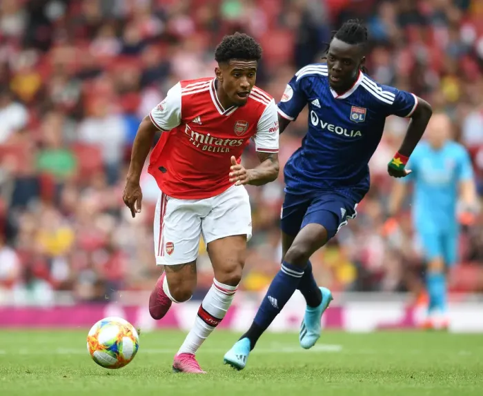 Framed Print : Arsenal's Reiss Nelson Outmaneuvers Olympique Lyonnais Bertrand Traore at Emirates Cup Framed Print : Arsenal's Reiss Nelson Outmaneuvers Olympique Lyonnais Bertrand Traore at Emirates Cup