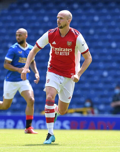 Arsenal's Rob Holding in Action at Ibrox Stadium: Arsenal vs. Glasgow Rangers (2021-22)