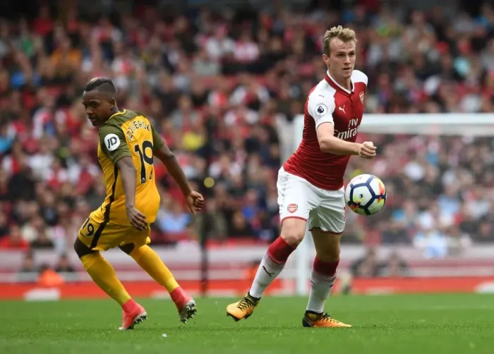 Framed Print : Arsenal's Rob Holding Battles Jose Izquierdo in Premier League Clash Framed Print : Arsenal's Rob Holding Battles Jose Izquierdo in Premier League Clash