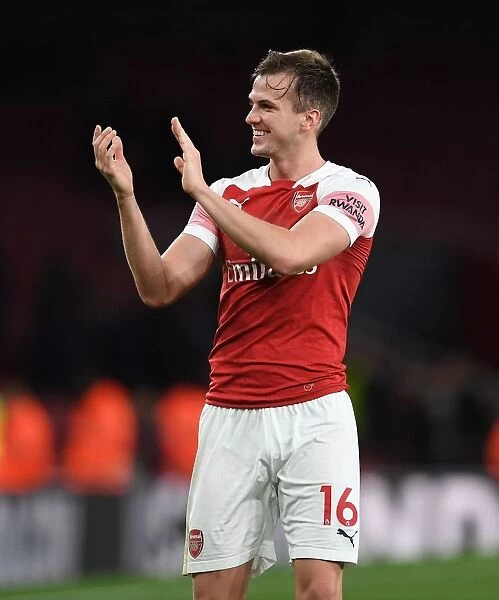 Arsenal's Rob Holding Celebrates with Fans after Derby Win over Tottenham