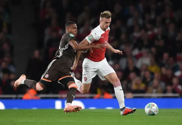 Framed Print : Arsenal's Rob Holding Clashes with Brentford's Ezri Konsa in Carabao Cup Showdown