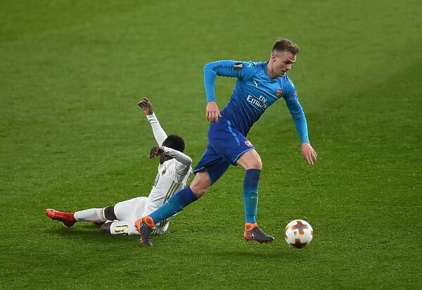 Arsenal's Rob Holding Clashes with Östersunds Frank Arhin in Europa League Showdown