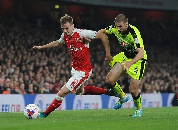 Arsenal's Rob Holding Clashes with Reading's Joey van den Berg in EFL Cup Showdown