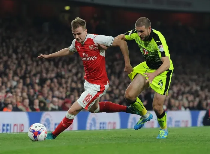 Framed Print : Arsenal's Rob Holding Clashes with Reading's Joey van den Berg in EFL Cup Showdown