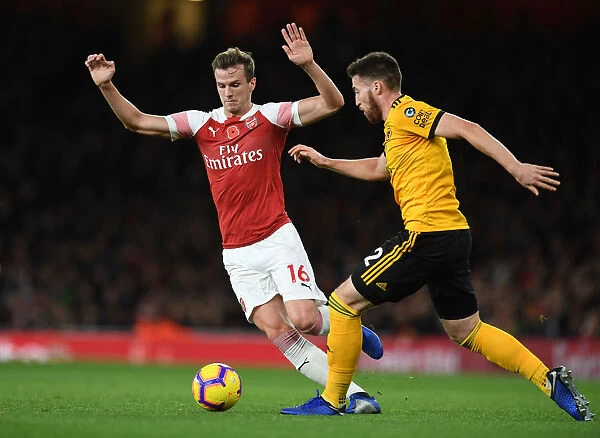 Arsenal's Rob Holding Clashes with Wolves Matt Doherty in Premier League Showdown