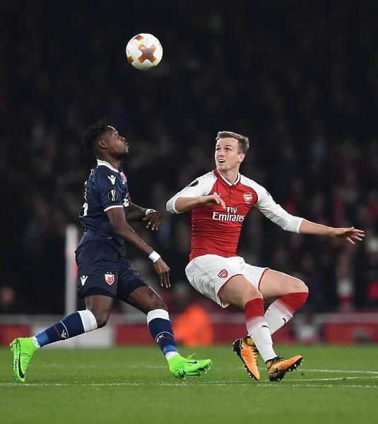 Arsenal's Rob Holding Faces Off Against Red Star's Richmond Boakye in Europa League Clash