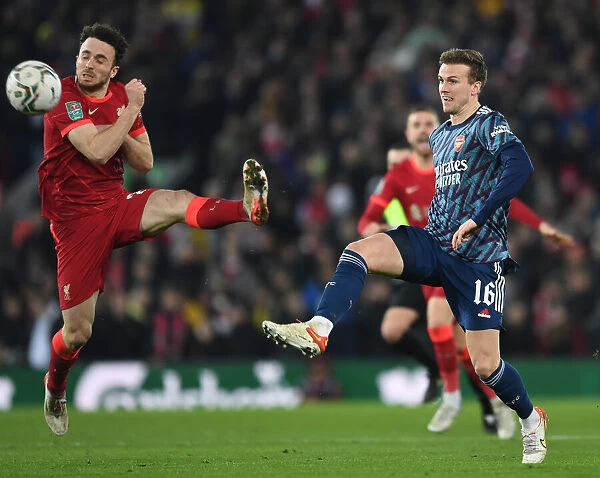 Arsenal's Rob Holding Fends Off Liverpool's Diogo Jota in Carabao Cup Semi-Final Clash