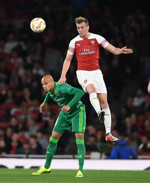 Arsenal's Rob Holding Intimidates Vorskla's Nicolas Carrera in Europa League Clash