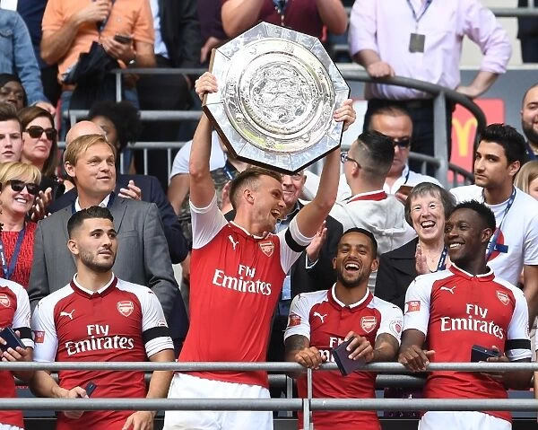 Arsenal's Rob Holding Lifts the FA Community Shield: Arsenal's Victory Celebration over Chelsea