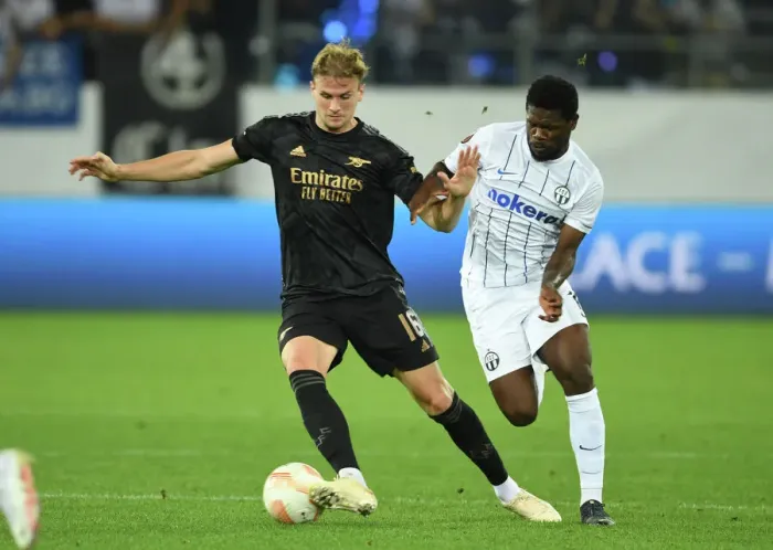Framed Print : Arsenal's Rob Holding Locks Eyes with FC Zurich's Tosin Aiyegun in Europa League Clash