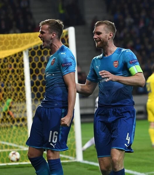 Arsenal's Rob Holding and Per Mertesacker Celebrate Goals in UEFA Europa League Match