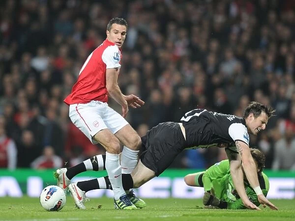 Arsenal's Robin van Persie Clashes with Newcastle's Mike Williamson and Tim Krul during the 2011-12 Premier League Match